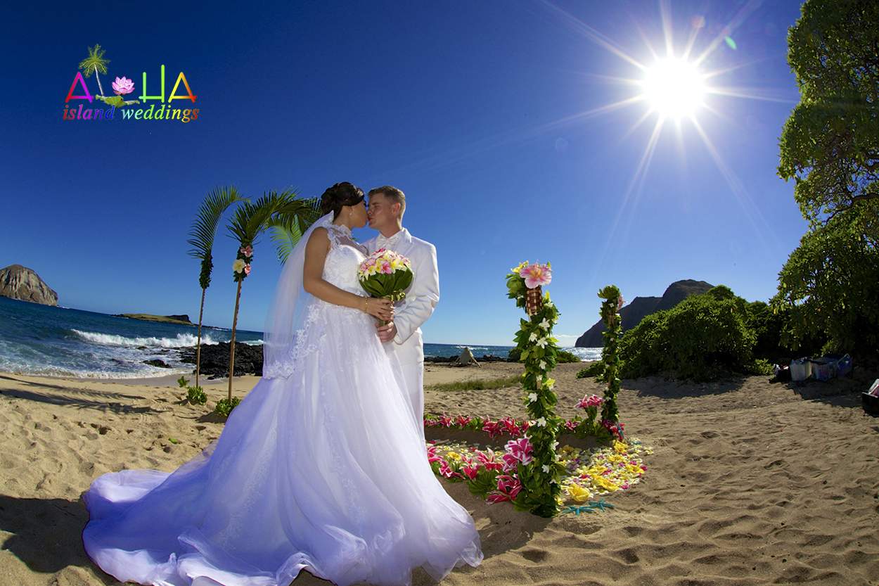 A Wedding in Hawaii For you Tara I love you the alchemy of real time present moments of the sun shinning like a rainbow you are a morning star while our lovely couple kissed by at their wedding in Hawaii palm archway